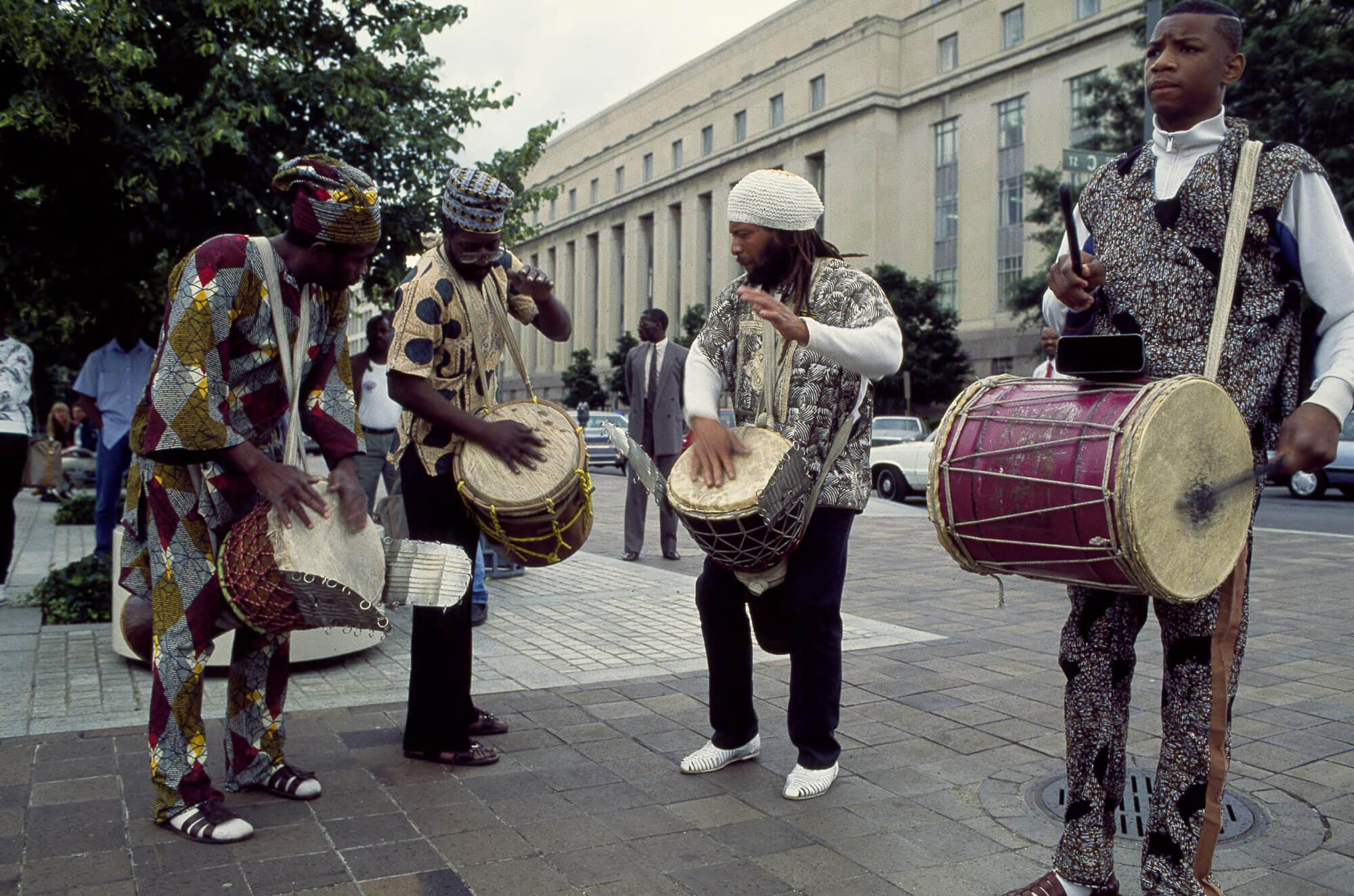 four street performers playing drums on Pennsylvania Avenue in Washington, D.C.