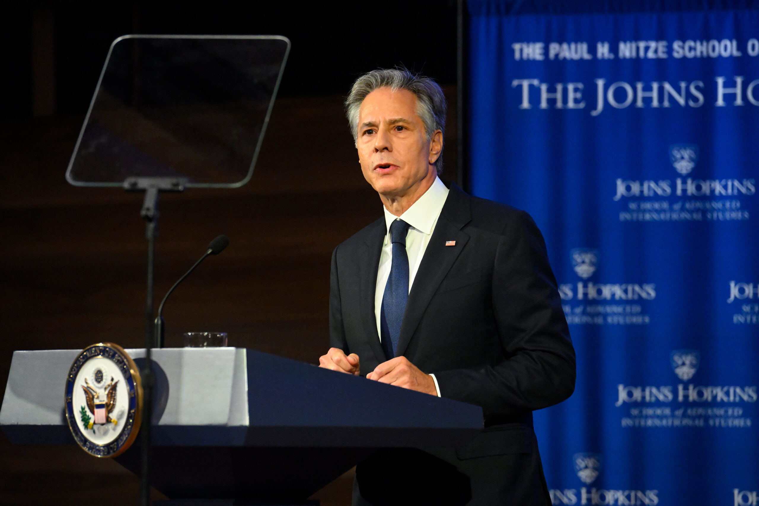 Antony Blinken delivers remarks from a podium